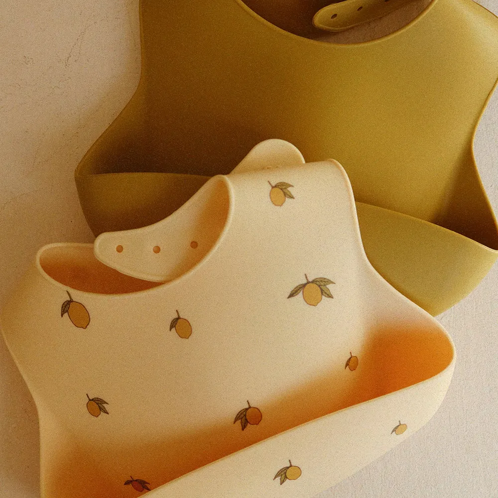 Konges Sløjd Silikoniset Ruokalaput 2-pack Lemon/Almond